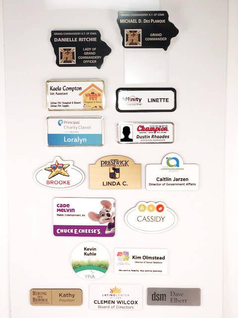 Examples of different types of name badges offered by APS Awards.